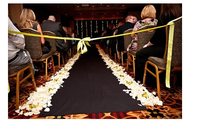 Flower petals in aisle at wedding